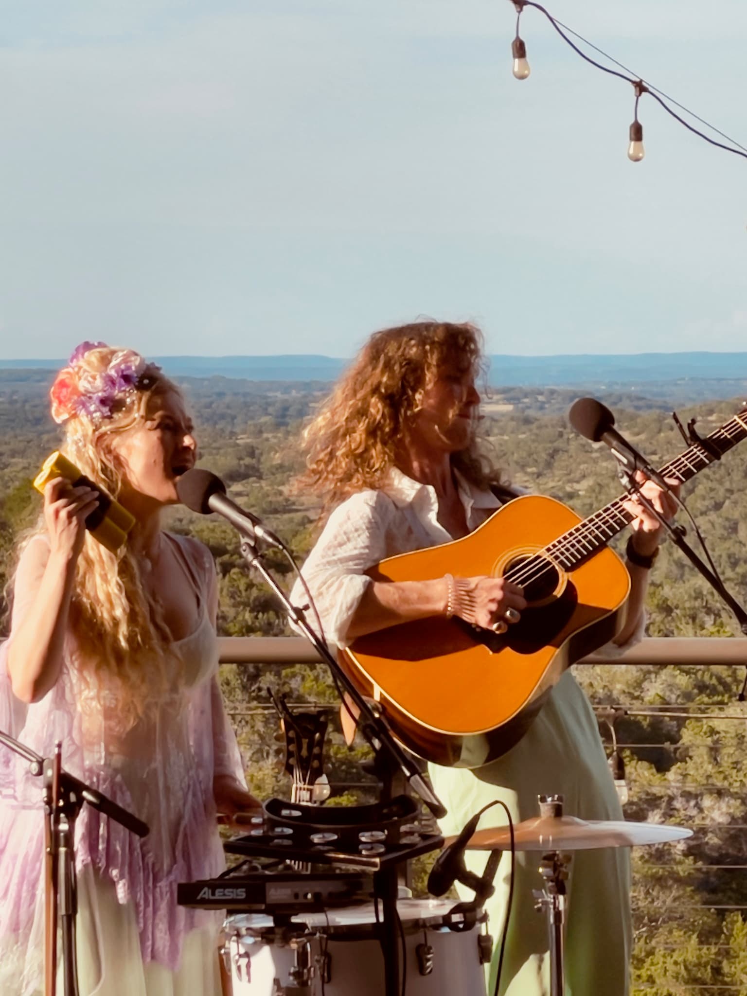 A live band playing on the deck at Hawk’s Shadow Winery at dusk.